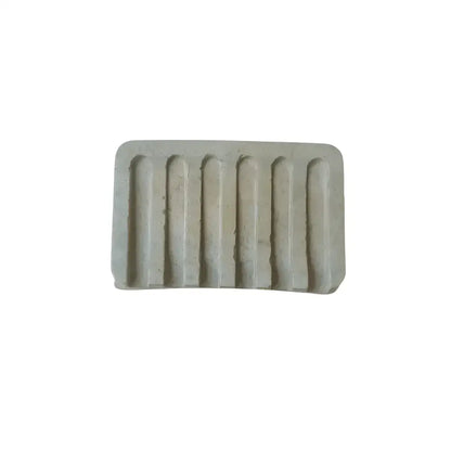 Light-colored soap dish with eight concave ridges from the Preen Your Feathers Robe set