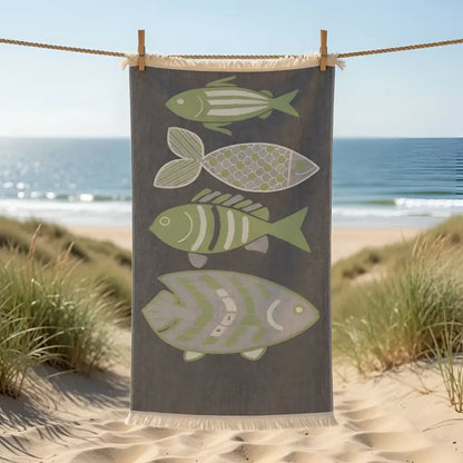 Dark gray turkish cotton muslin beach towel with fringe and four green and white stylized fish design