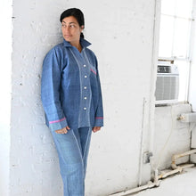 Woman in Indigo Tribeca Loungewear Set with light blue long sleeve collared pajamas