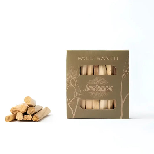 Eight Palo Santo sticks for smudging in a recycled cardboard box.