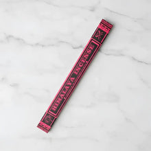 A vibrant pink and black himalaya incense stick package made by tibetan nuns from khachoe ghakyil ling nunnery