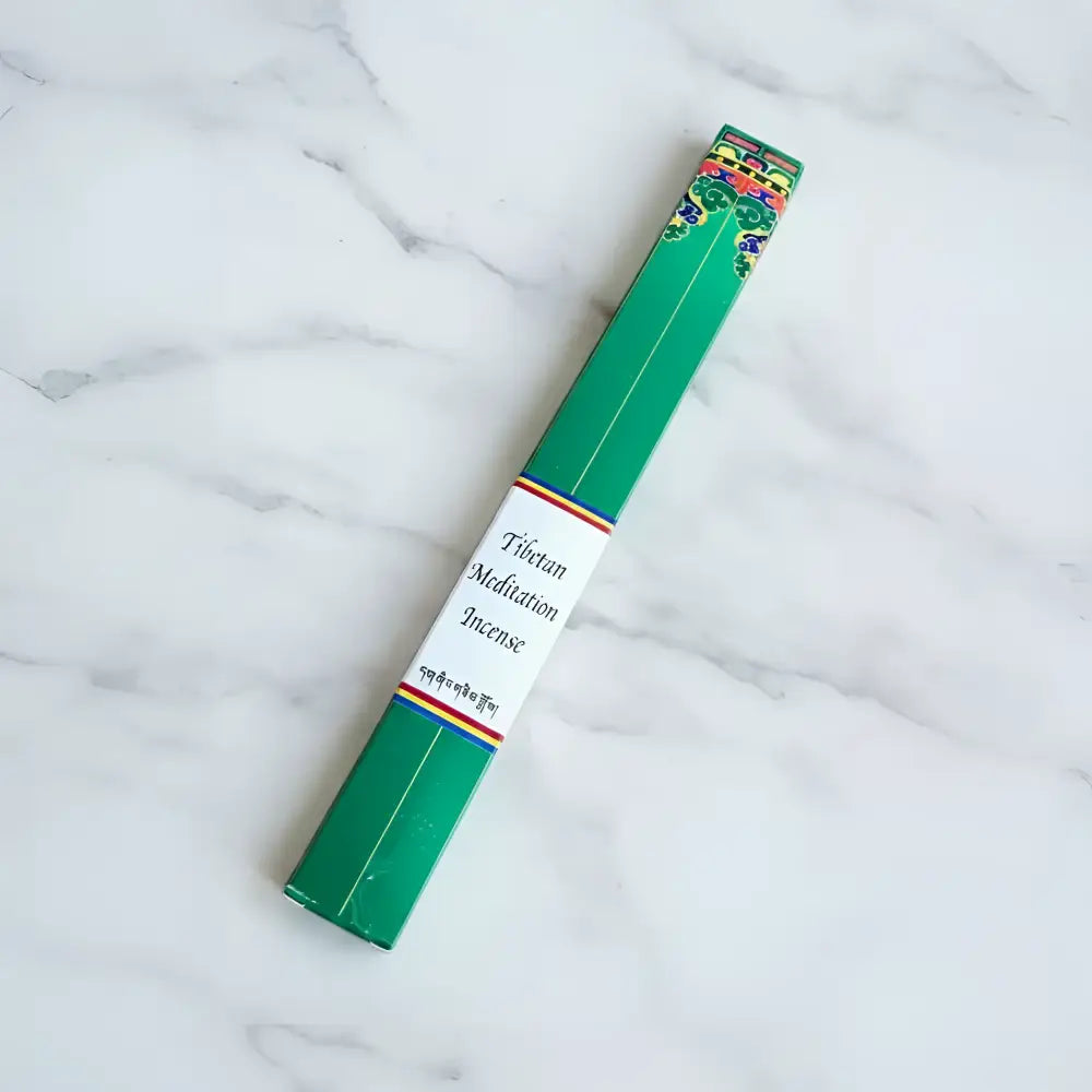 Green rectangular box of pure natural tibetan meditation incense by tibetan nuns from khachoe ghakyil ling with colorful patterns