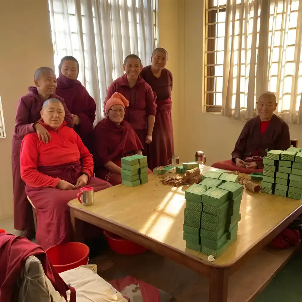 Stacks of green rectangular boxes of pure natural incense made by tibetan nuns from khachoe ghakyil ling nunnery
