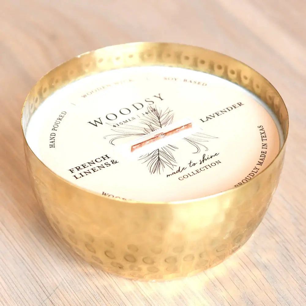 Gold hammered bowl soy candle with wooden wick in solid brass bowl and crushed thyme