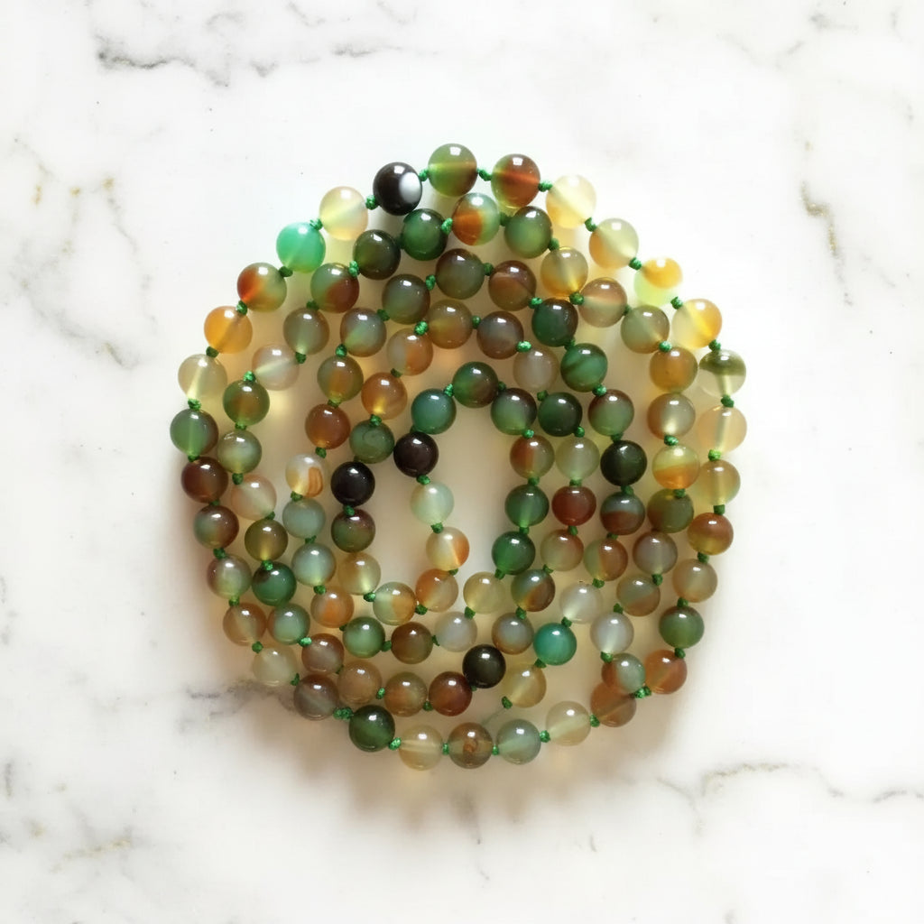 Handmade eco-friendly rainbow agate malas featuring 6mm multi-colored translucent beads with beaded tassel