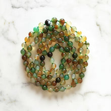 Handmade eco-friendly rainbow agate malas featuring 6mm multi-colored translucent beads with beaded tassel
