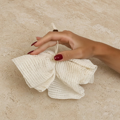 Ramie shower pouf in off white made from pure ramie plant fibers for a natural exfoliation experience