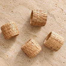 Natural woven rattan napkin rings set of four with tight uniform weave in light tan color for table decor
