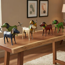 Colorful reclaimed metal dogs in assorted hues, hand-painted figurines