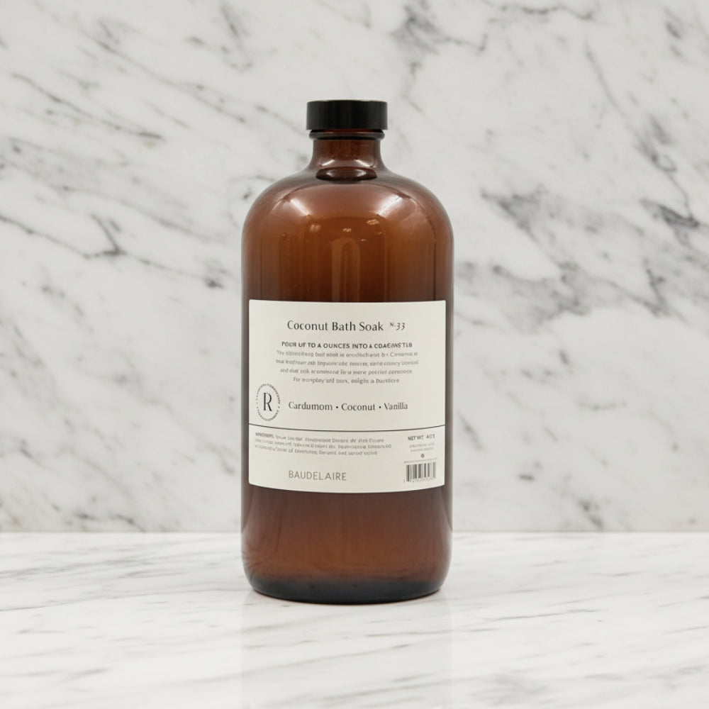 Handcrafted Baudelaire Replenish Coconut Bath Soak in amber glass bottle