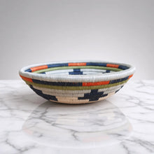 Handwoven rings small sisal bowl with navy orange olive green and white geometric pattern and hanging loop