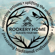 Black circular rookery home gift card logo with stylized tree branches bird and woven stick nest design