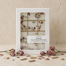 White rectangular box of rose sandalwood soy-beeswax melts with dried petals and phthalate-free fragrance