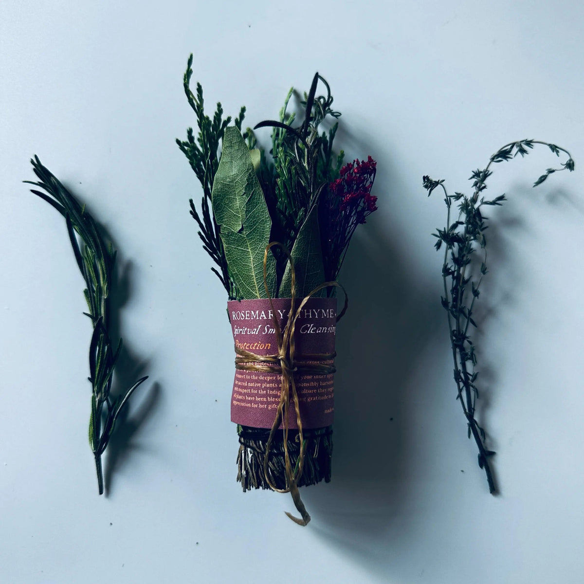 Handmade eco-friendly rosemary smoke cleansing bundle with thyme, sage, twine