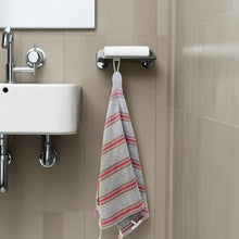 Striped Turkish hand towel with fringes hanging from a white loop, made of premium cotton hand towels