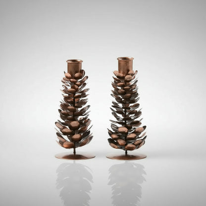 Rustic pinecone candle holders set in copper and brown bronze finish for cozy decor