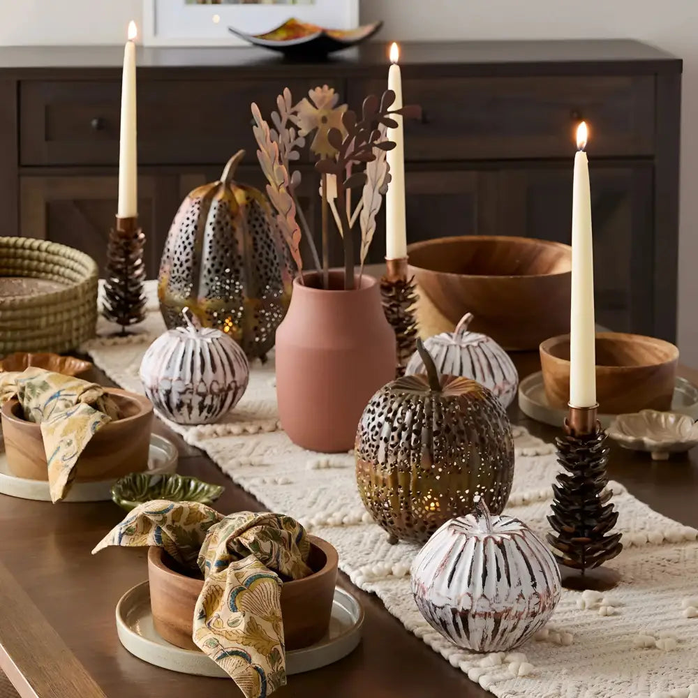 Gold glitter pumpkin with wooden stem and base, perfect for rustic pinecone candle holders