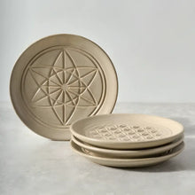 Sacred Designs Appetizer Plates with unique embossed patterns in light ceramic set
