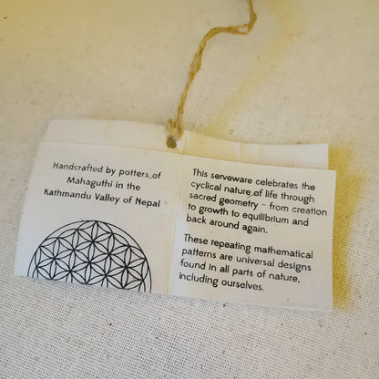 White paper tag with string on Sacred Designs Appetizer Plates with unique embossed patterns