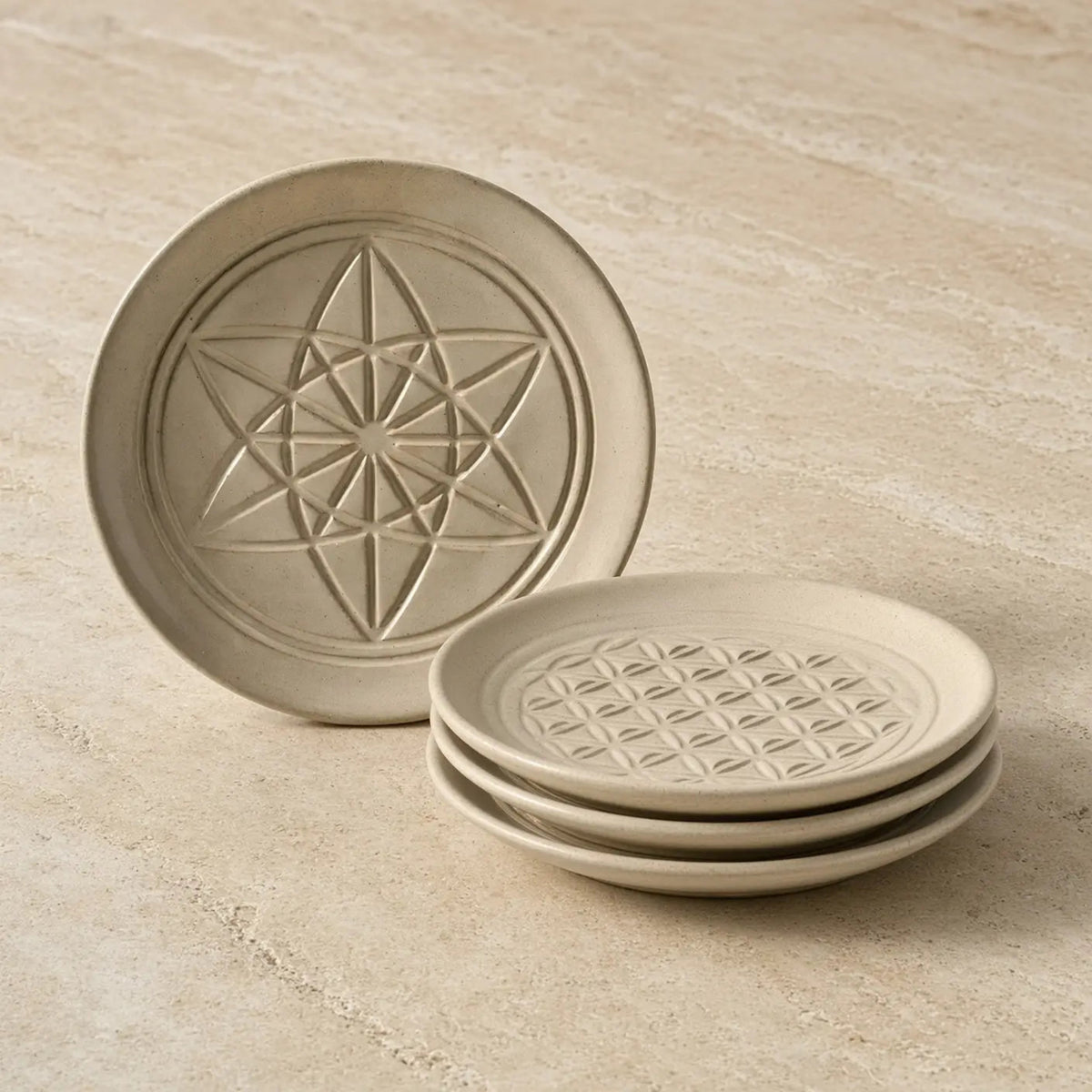 Beige ceramic sacred designs appetizer plates with unique embossed patterns and geometric texture
