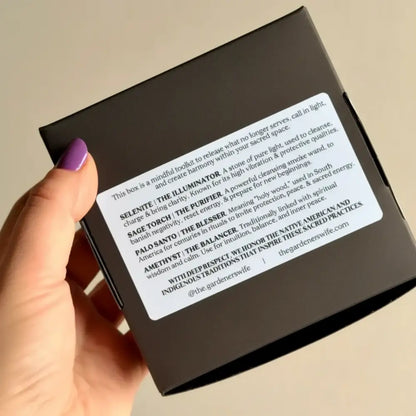 Black rectangular box labeled sacred space ritual kit with palo santo stick sage crystals for creating intentional space