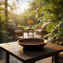 Wooden bowl on a table in a lush tropical setting
