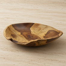 Large live edge hand carved wooden bowl made from salvaged teak roots with natural swirling tan and brown patterns