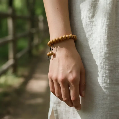 A natural wood bead sandalwood mala bracelet with an earthy simple design perfect for daily wear