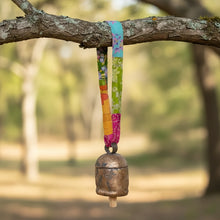 Upcycled Sari Fabric Copper Bell Sari Ribbon Bell hanging from colorful fabric strap