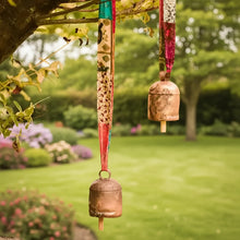 Upcycled sari fabric copper bell hanging as a Sari Ribbon Bell decoration