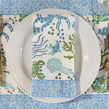 White cotton sea life napkins set of 4 with blue green ocean block print featuring fish octopuses and coral