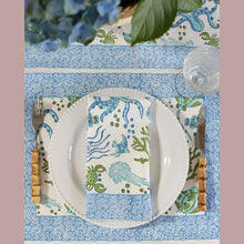White plate with beaded rim on Sea Life napkin from set of 4