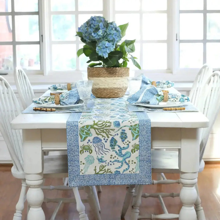 White wooden dining table with sea life table runner, cotton table runner, block print runner