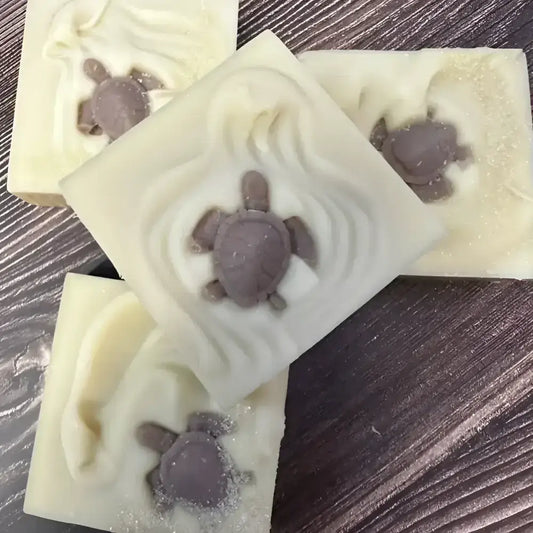 Handmade sea turtle French lavender bar soap with purple turtle embeds and glitter