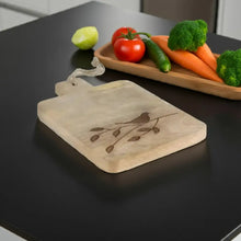 Light-colored mango wood board with branch design and bird engraving for Rookery Home