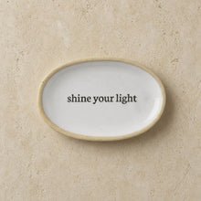White ceramic petite oval trinket dish with beige rim and shine your light print perfect for lip balm or ceramic catch-all