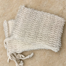 White textured woven sisal soap saver bag with drawstring closure for gentle exfoliation and soap storage