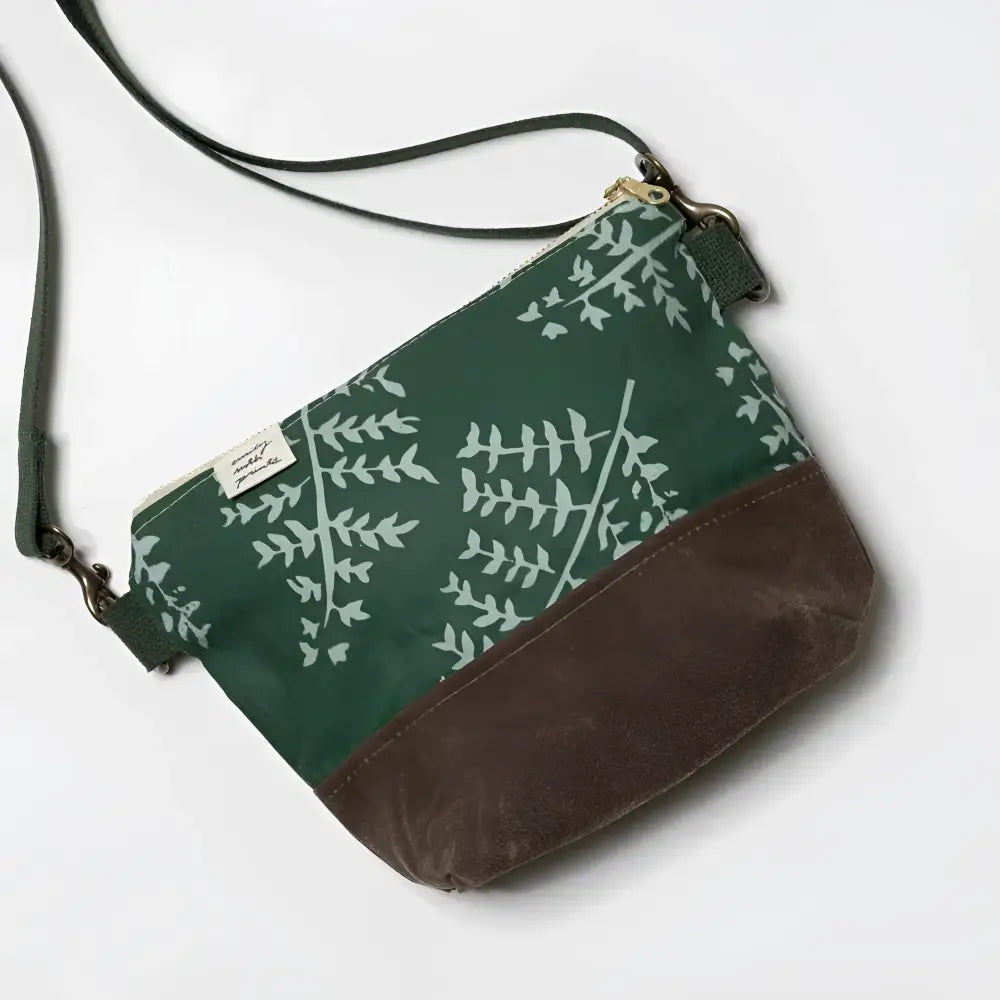 Small crossbody bag in dark green canvas with white fern design brown suede bottom and gold-tone hardware