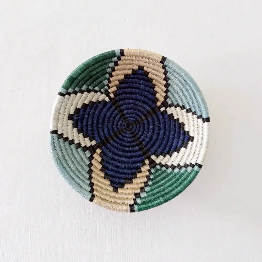 Small star sisal bowl handwoven african basket with navy blue teal green cream and black geometric pattern and hanging loop