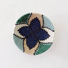 Small star sisal bowl handwoven african basket with navy blue teal green cream and black geometric pattern and hanging loop