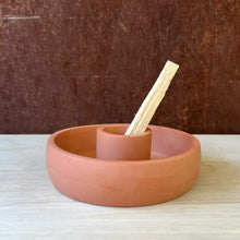 Incense and smudge dish in a terra cotta color.