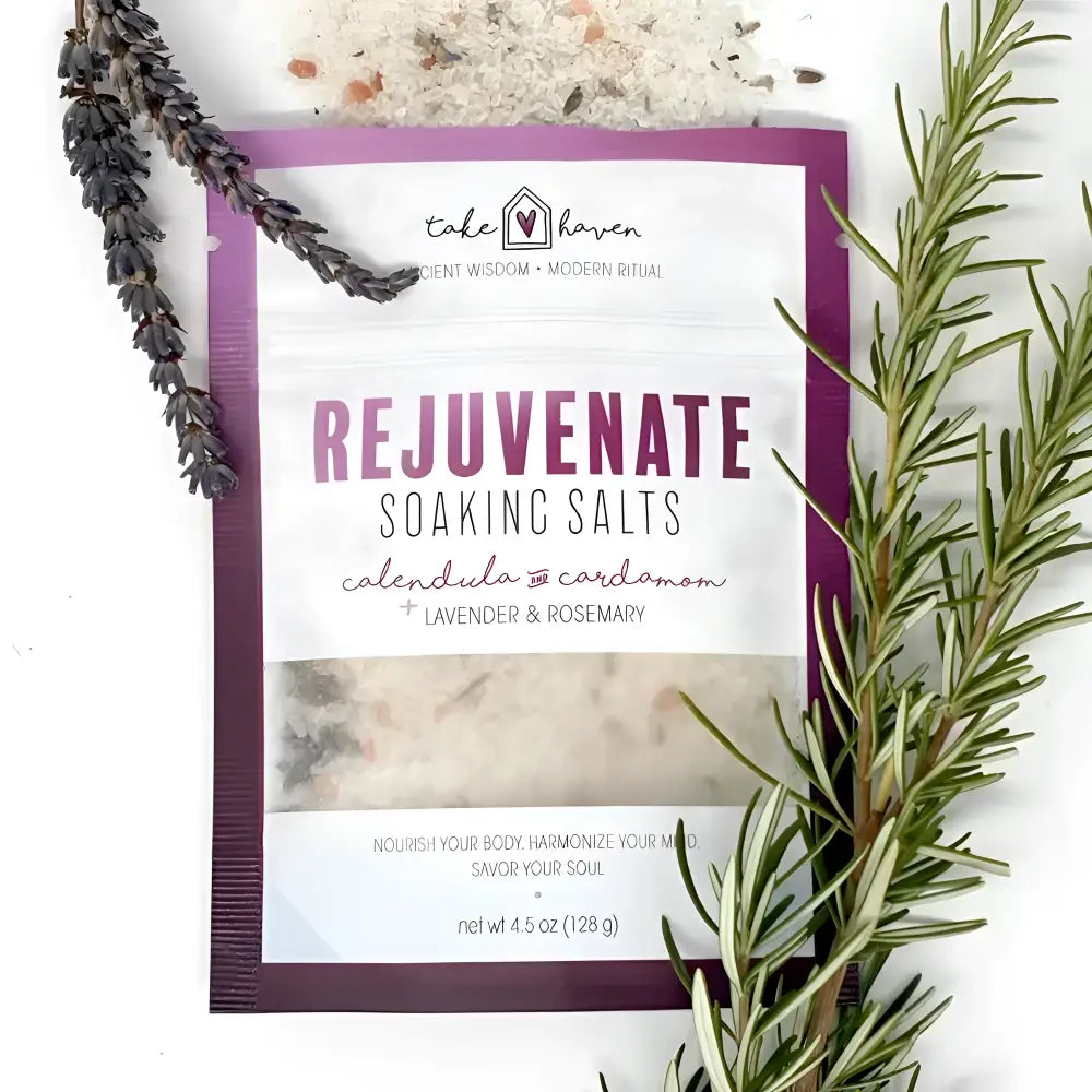 Purple and white pouch of take haven soaking salts to rejuvenate with lavender rosemary calendula and cardamom using essential oils