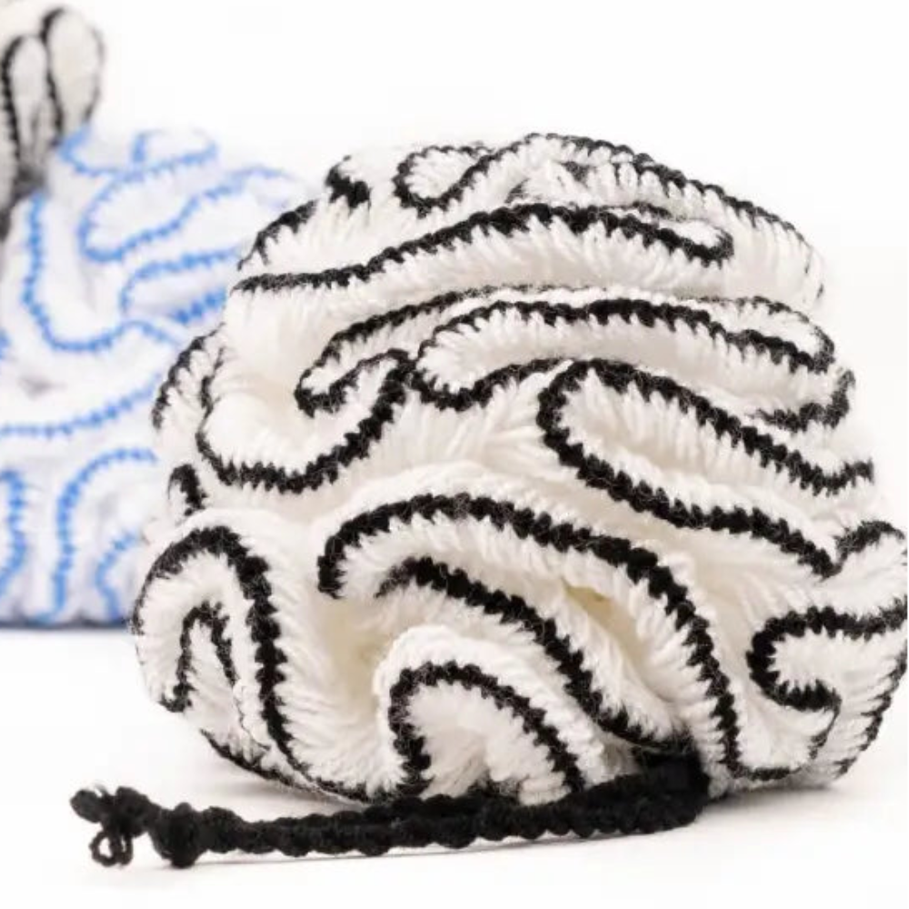 White and black bathing pouf in soft organic cotton bath pouf