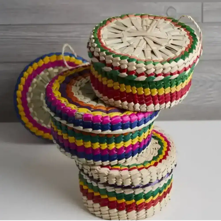 Stack of colorful baskets on table