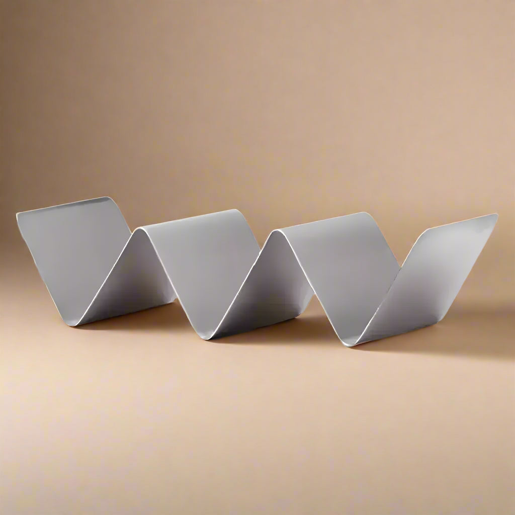 Silver-colored steel upright taco rack with three slots for serving tacos