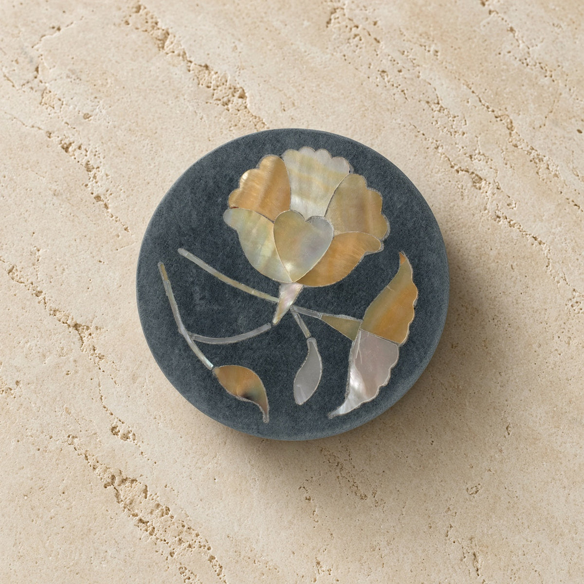 A dark gray palewa stone bloom box trinket box with intricate mother-of-pearl and gold-toned floral inlay from tara projects