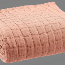 Soft peach-colored cotton lightweight quilt with a subtle grid pattern, perfect king size bedding