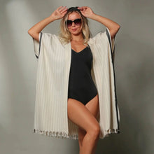 Light-colored striped Turkish Kimono Cover Up with fringed edges, perfect as a kimono cover