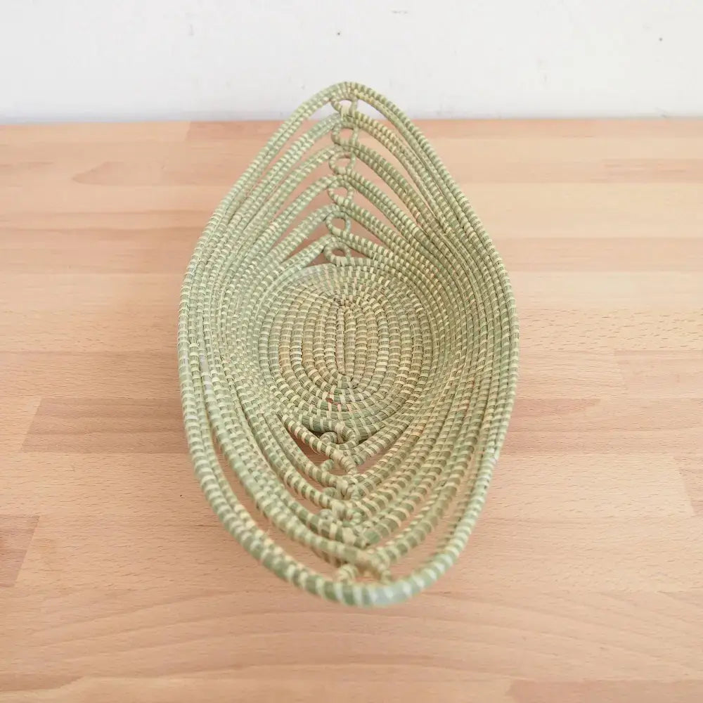 Woven light green sweetgrass African bread basket made with swamp grass for decorative use