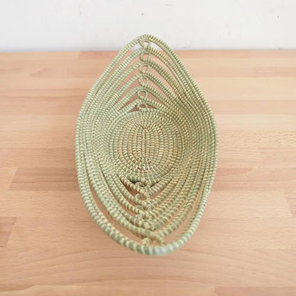 Woven light green sweetgrass African bread basket made with swamp grass for decorative use